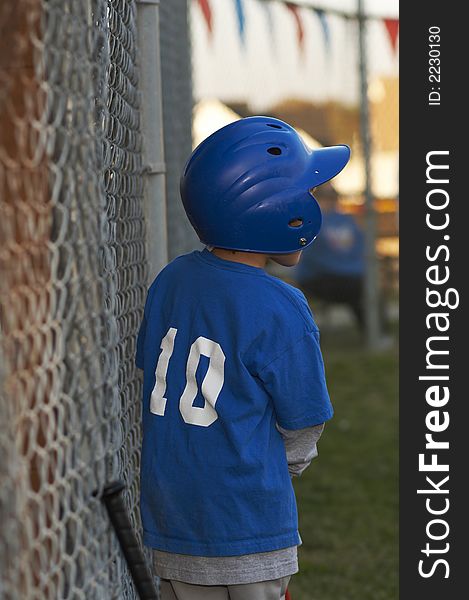 Young kid in baseball blue uniform. Young kid in baseball blue uniform