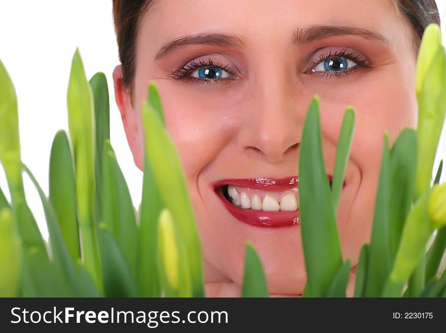 Portrait of smiling woman with fresh green flowers growing, focus on face, isolated on white. Portrait of smiling woman with fresh green flowers growing, focus on face, isolated on white