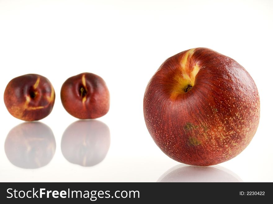 Fresh colored peaches close up