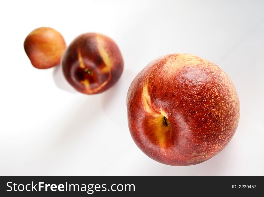 Fresh colored peaches close up