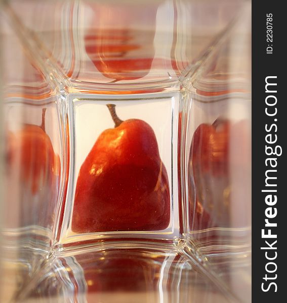 Red Ripe Pear In The Glass Box