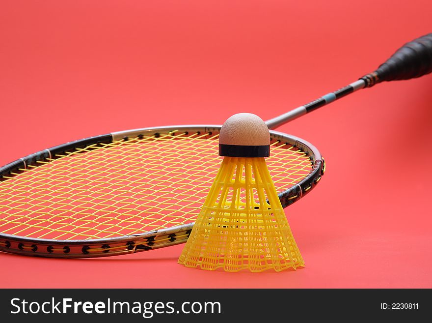 Badminton racket with red background