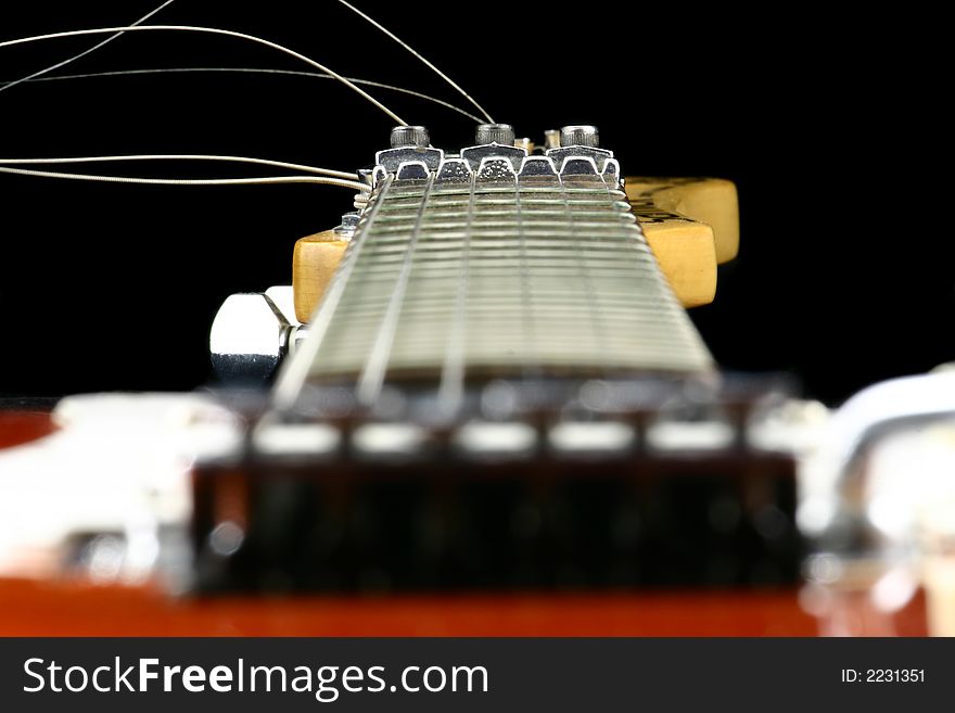 Close up at guitar finger board with focus set on neck. Close up at guitar finger board with focus set on neck