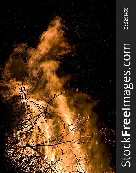 A photo of burning wood with detailed flames. A photo of burning wood with detailed flames