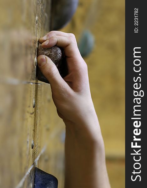 Climber´s hand caught on the climbing wall