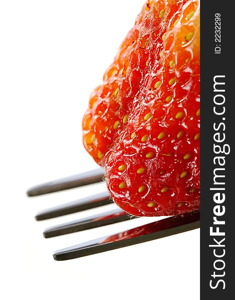 Delightful strawberry in strict laying on the fork. Delightful strawberry in strict laying on the fork