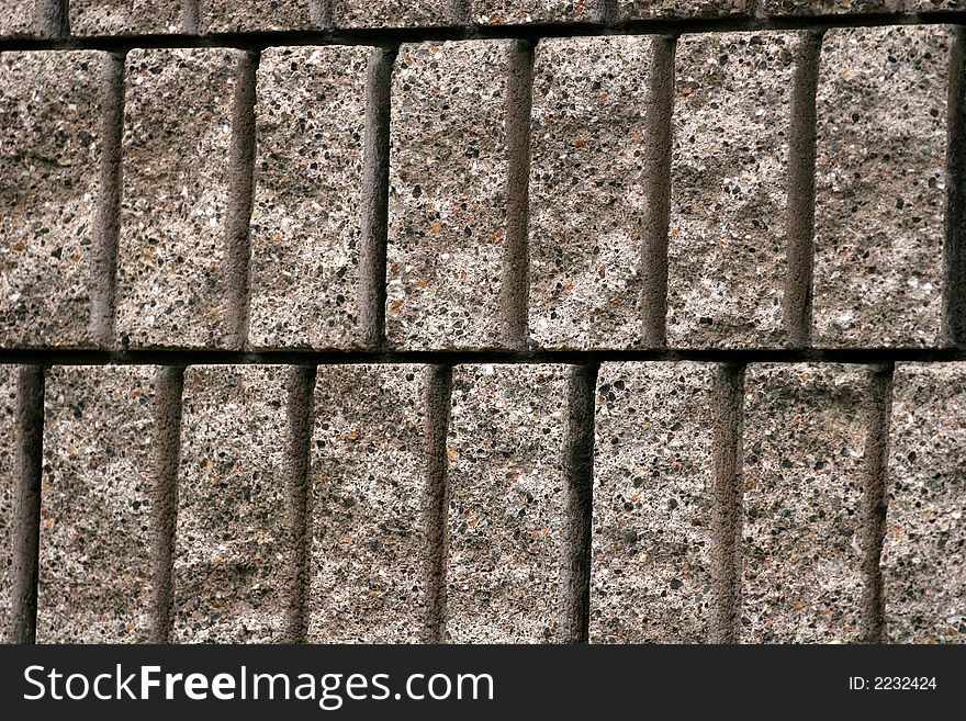 A wall of interlocking blocks useful for details or background