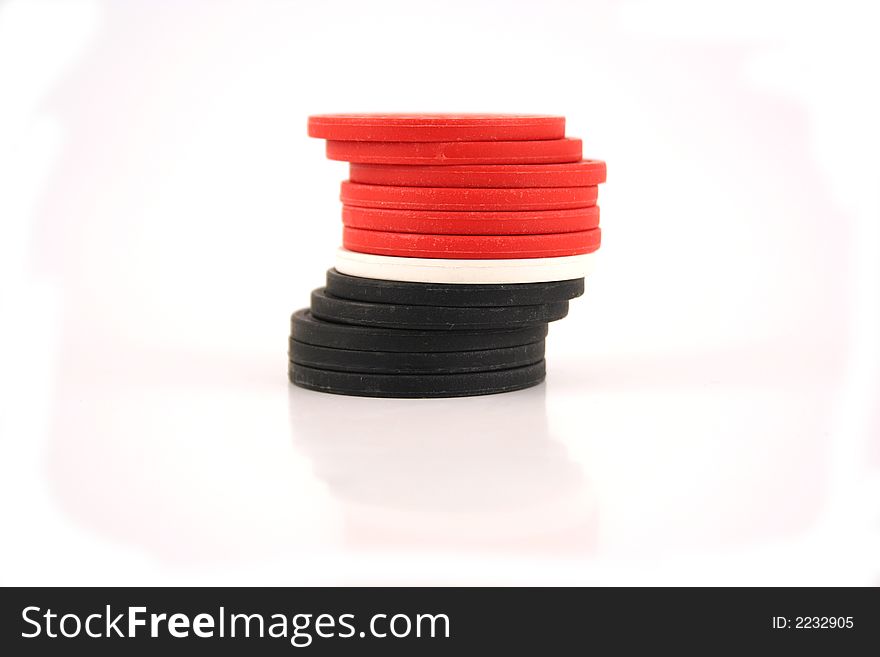 An image of red, white and black poker chips