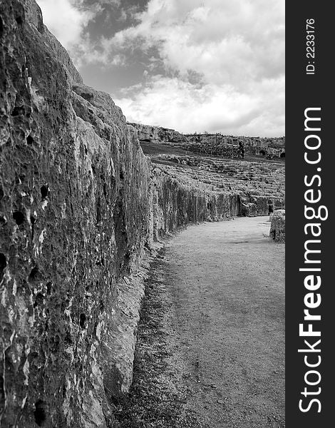 The ancient ruin of the Greek Theater to Syracuse Sicily. Inside Cavea. The ancient ruin of the Greek Theater to Syracuse Sicily. Inside Cavea