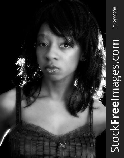 Beautiful young African American woman in black and white portriat. Beautiful young African American woman in black and white portriat.