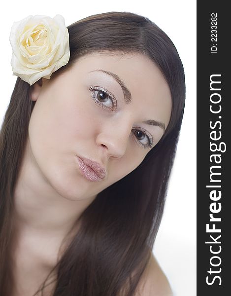 Girl with a white rose behind an ear