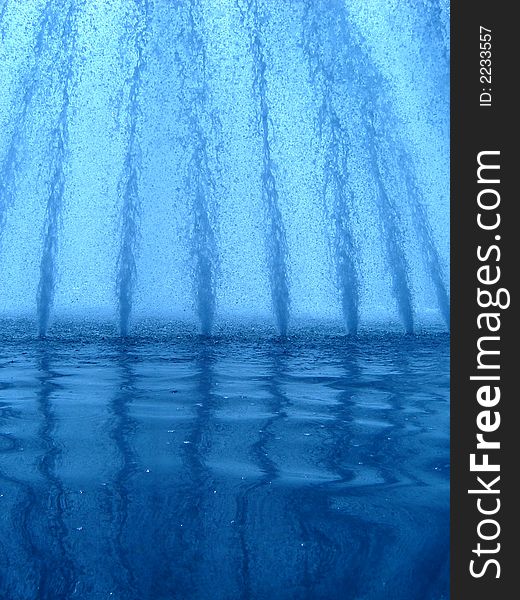 Water splashes rising high from the fountain. Water splashes rising high from the fountain