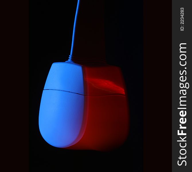 Swing mouse showing movement blur. Red and blue lights used. Swing mouse showing movement blur. Red and blue lights used.