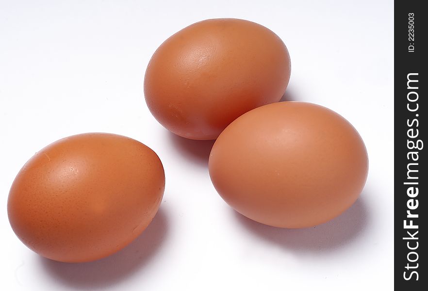 Three eggs on white background