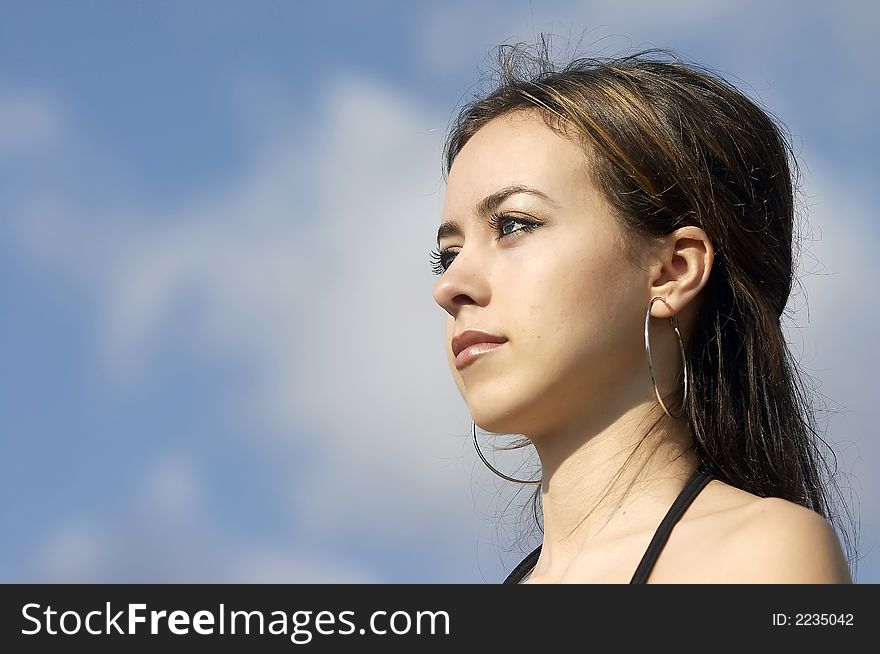 Attractive young businesswoman facing the future