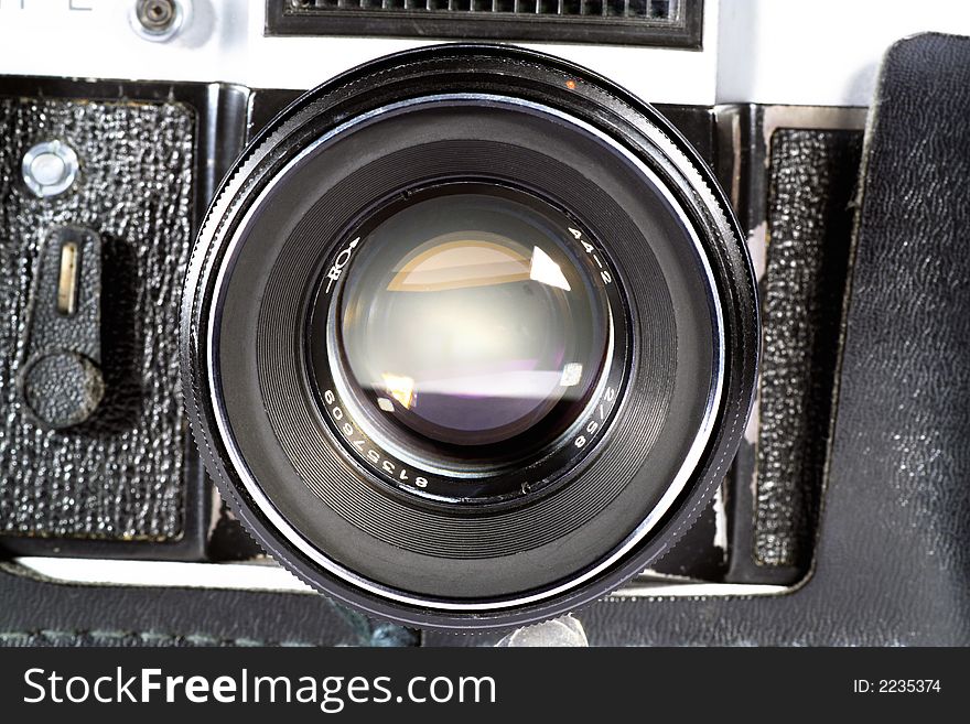 Old SLR camera lens shot isolated on a white background