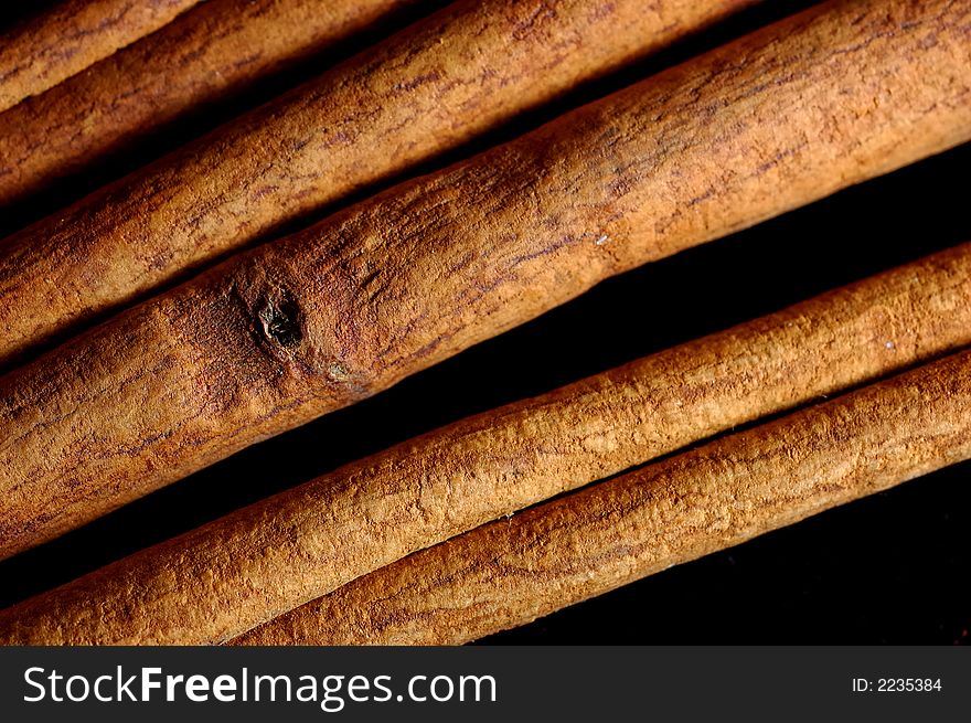 Cinnamon sticks close up on black background