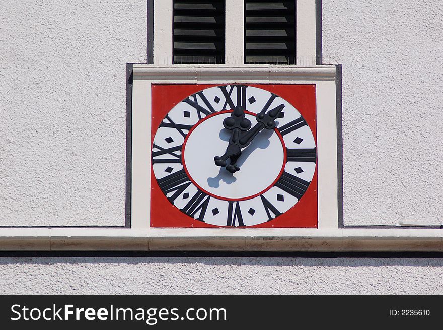 Clock showing 5 minutes  past 12 . St. Mark´s Church Tower, Zagreb, Croatia.