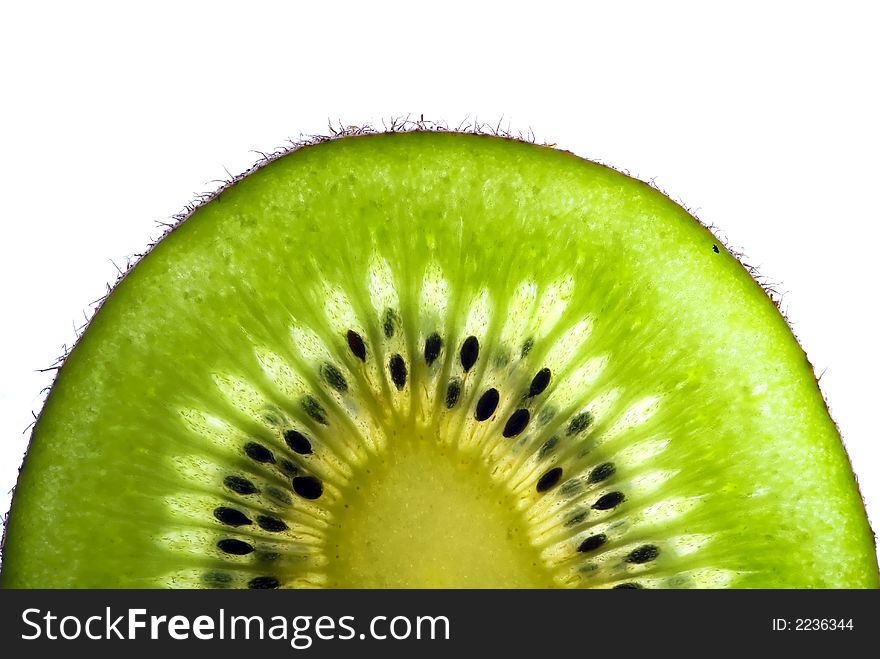 Lushes green slice of a kiwi isolated on white background