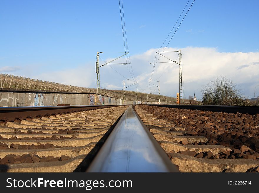 A track of a railway with blue sky