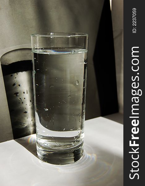 Glass of water on a black and white background. Glass of water on a black and white background