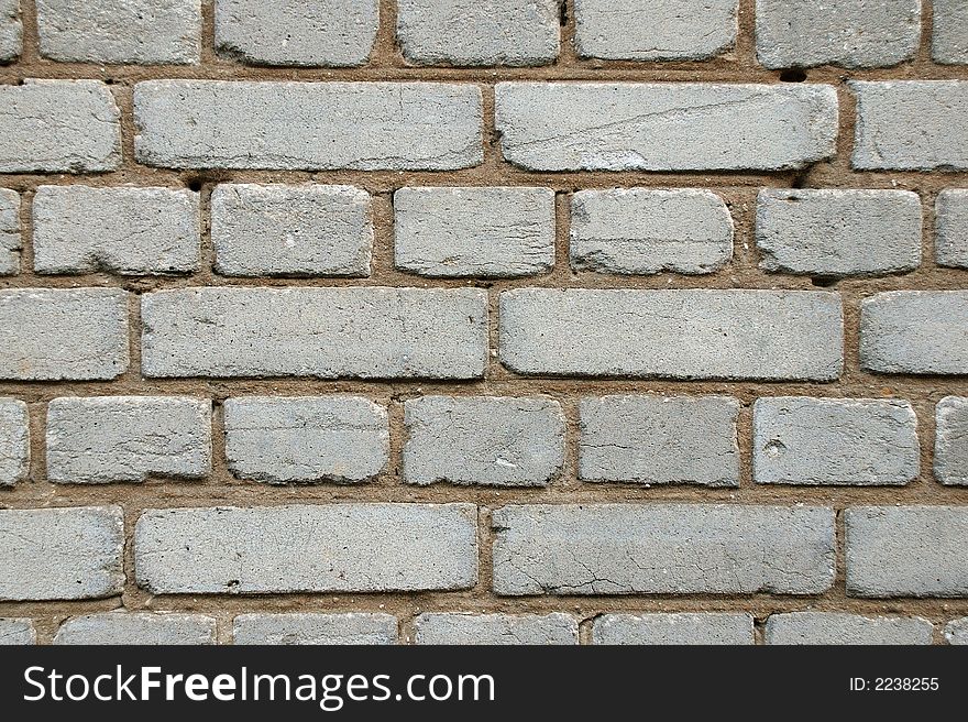 Wall of white bricks. Close-up view. Cement.