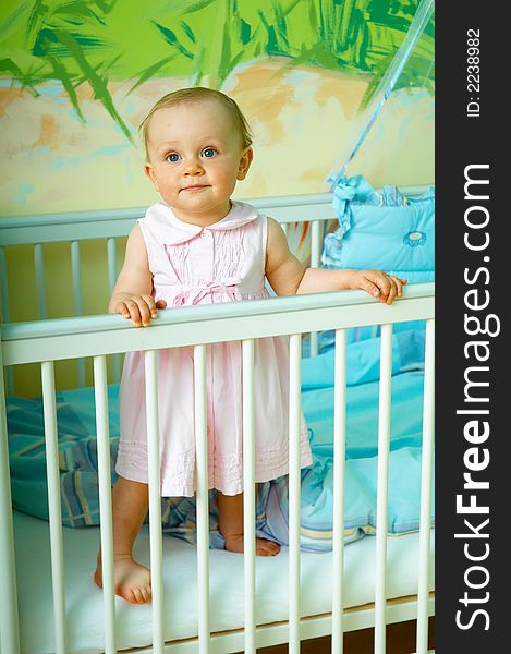 Portrait od little girl in crib. Portrait od little girl in crib
