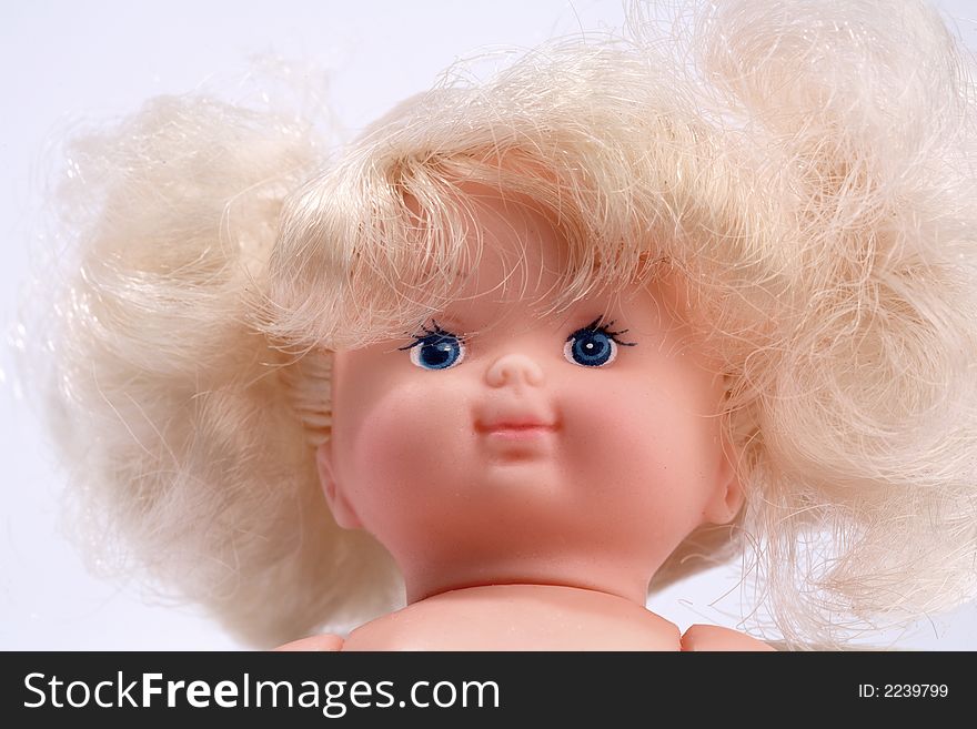 A doll and a white background