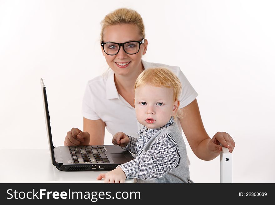 Baby Sitter with small pupil and a laptop. Baby Sitter with small pupil and a laptop