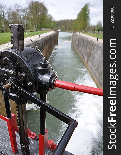 Lock gate on a canal opening to allow boats to continue. Lock gate on a canal opening to allow boats to continue