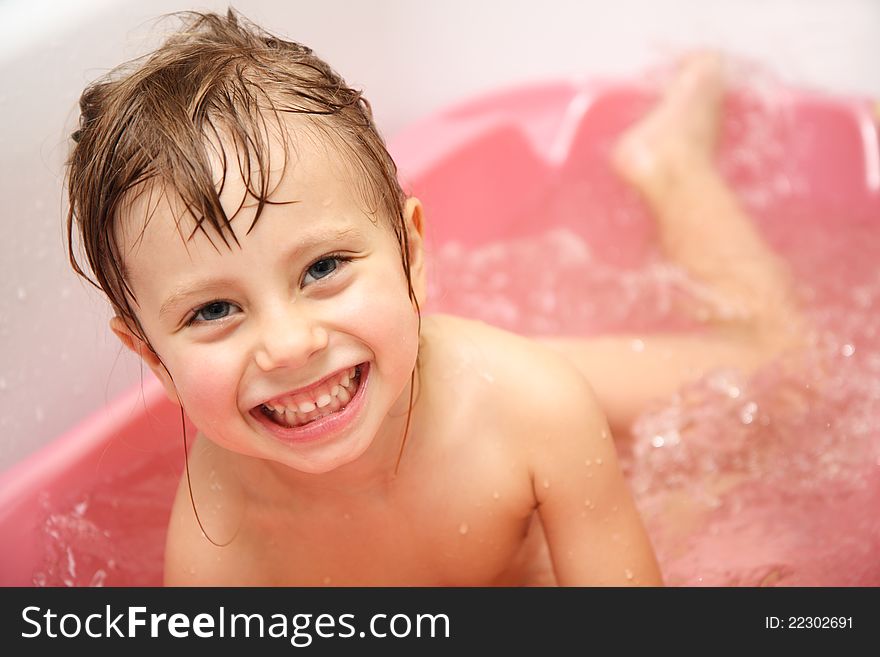 Child Bathes In A Bathroom