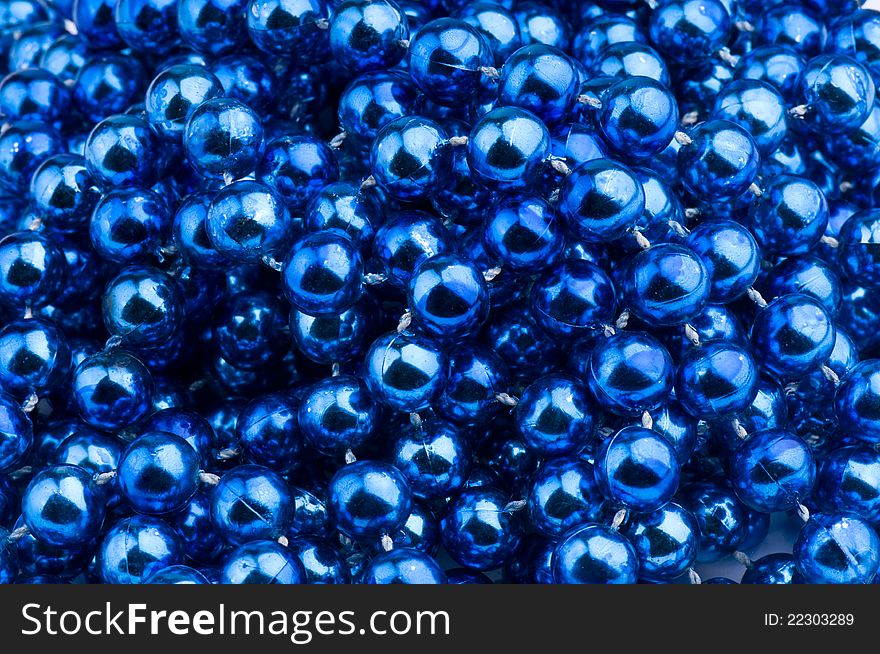 Backgroun of blue Christmas beads