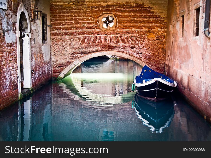 Europe flag covering a boat on water in venezia. Europe flag covering a boat on water in venezia