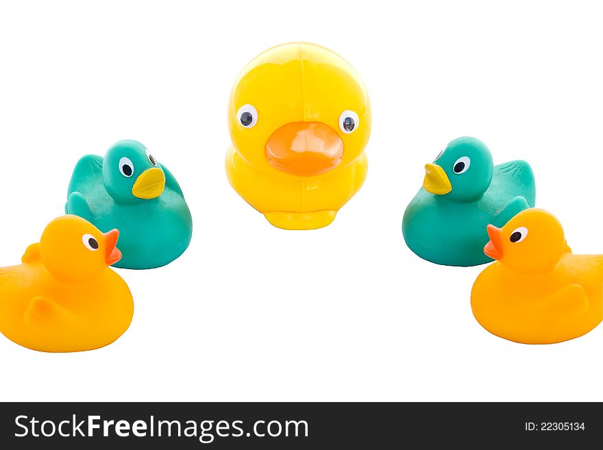 A family of yellow and green toy ducks.