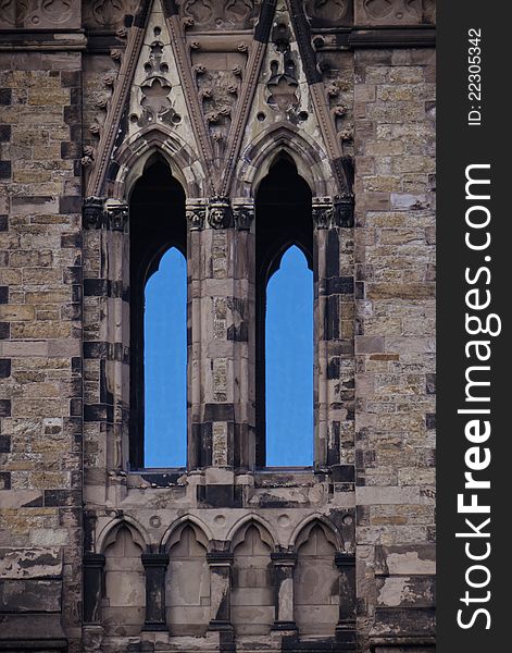 Close up of 18th century church spire window and its windows revealing blue skies. Close up of 18th century church spire window and its windows revealing blue skies.