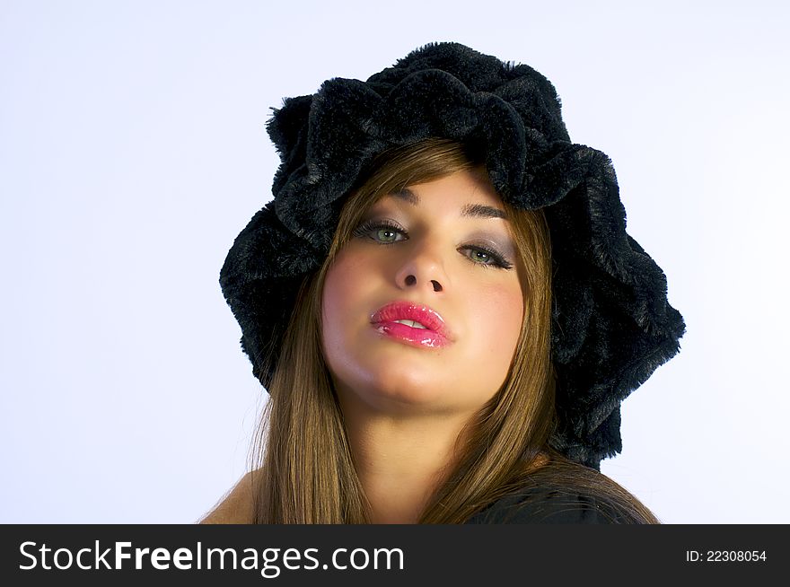 Beautiful Young girl with black velvet hat on white backround. Beautiful Young girl with black velvet hat on white backround.