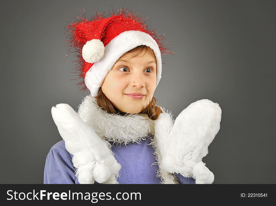 Surprised girl with santa hat isolated in studio. Surprised girl with santa hat isolated in studio