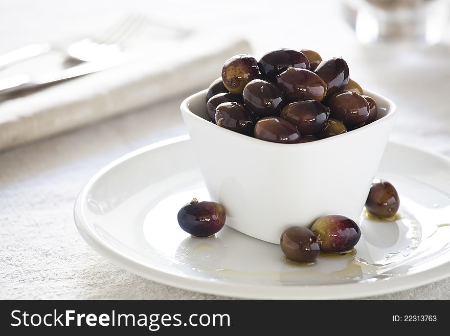 Close up photograph of fresh olives in a bowl. Close up photograph of fresh olives in a bowl