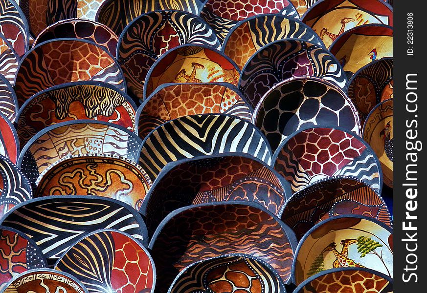 Colorful african wooden bowls in sunlight