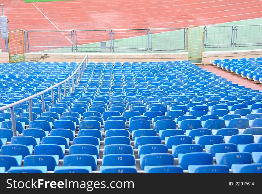 Empty Plastic Chairs at the Stadium