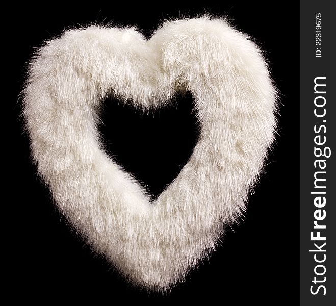 Furry white heart isolated on black