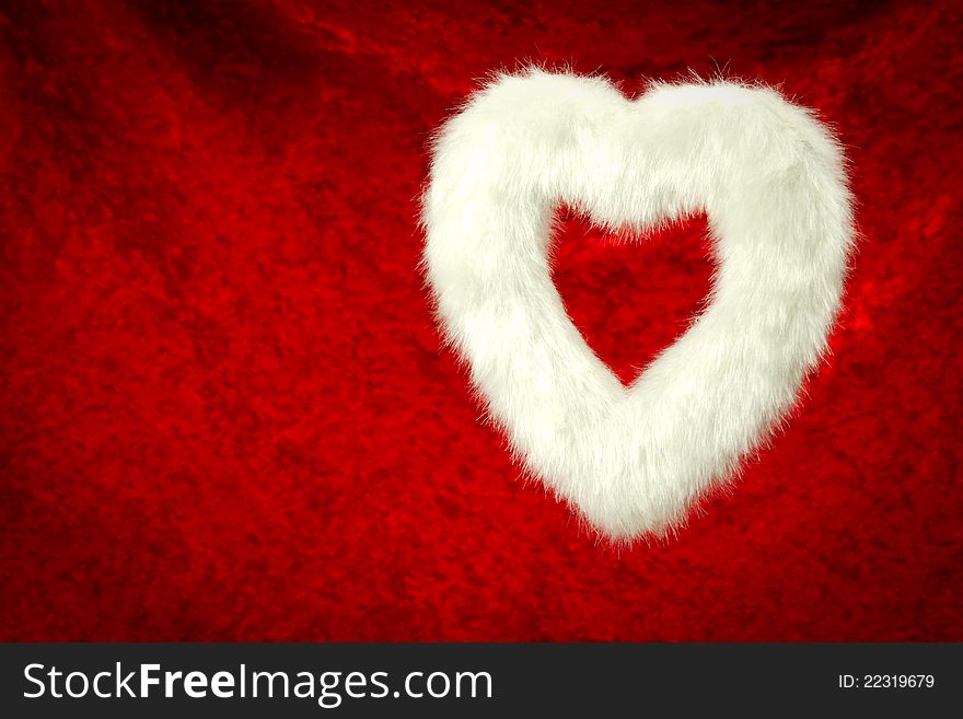 Furry white heart on red background