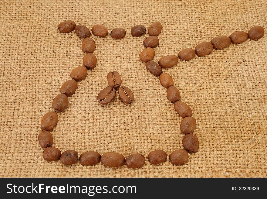 Coffee maker is made of coffee grains on a bag