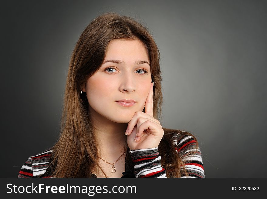 Woman thinking, a grey background. Woman thinking, a grey background