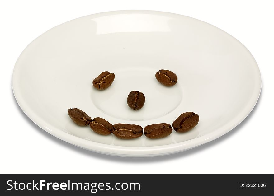 Happy coffee beans over creamy plate