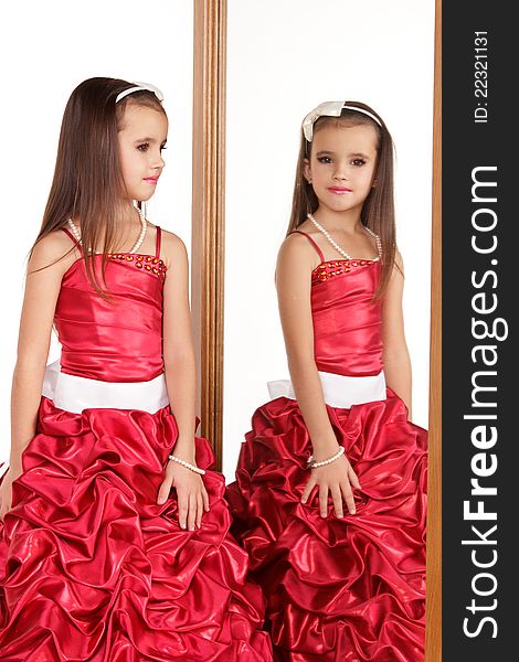 Beautiful little girl in red evening dress