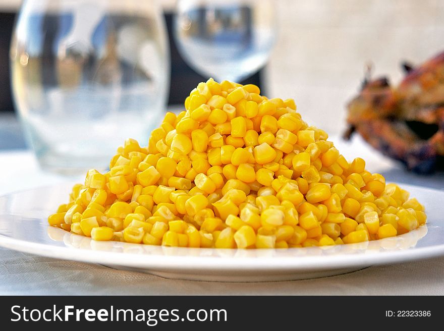 Corn On A Plate As Part Of A Dinner Table Set Up