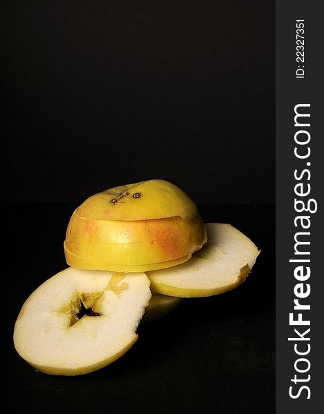 Closeup with sliced apple studio isolated on black background. Closeup with sliced apple studio isolated on black background