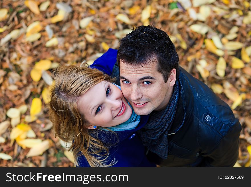 Happy Couple Standing Together in the Park During Autumn. Happy Couple Standing Together in the Park During Autumn