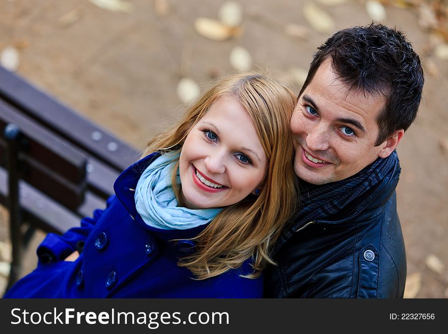 Happy Couple Standing Together in the Park During Autumn. Happy Couple Standing Together in the Park During Autumn